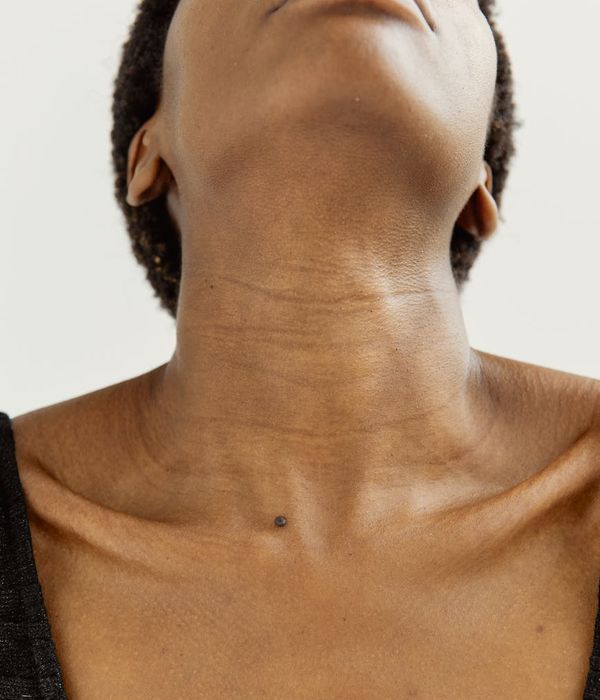 Woman in a calm yoga pose for neck and shoulders